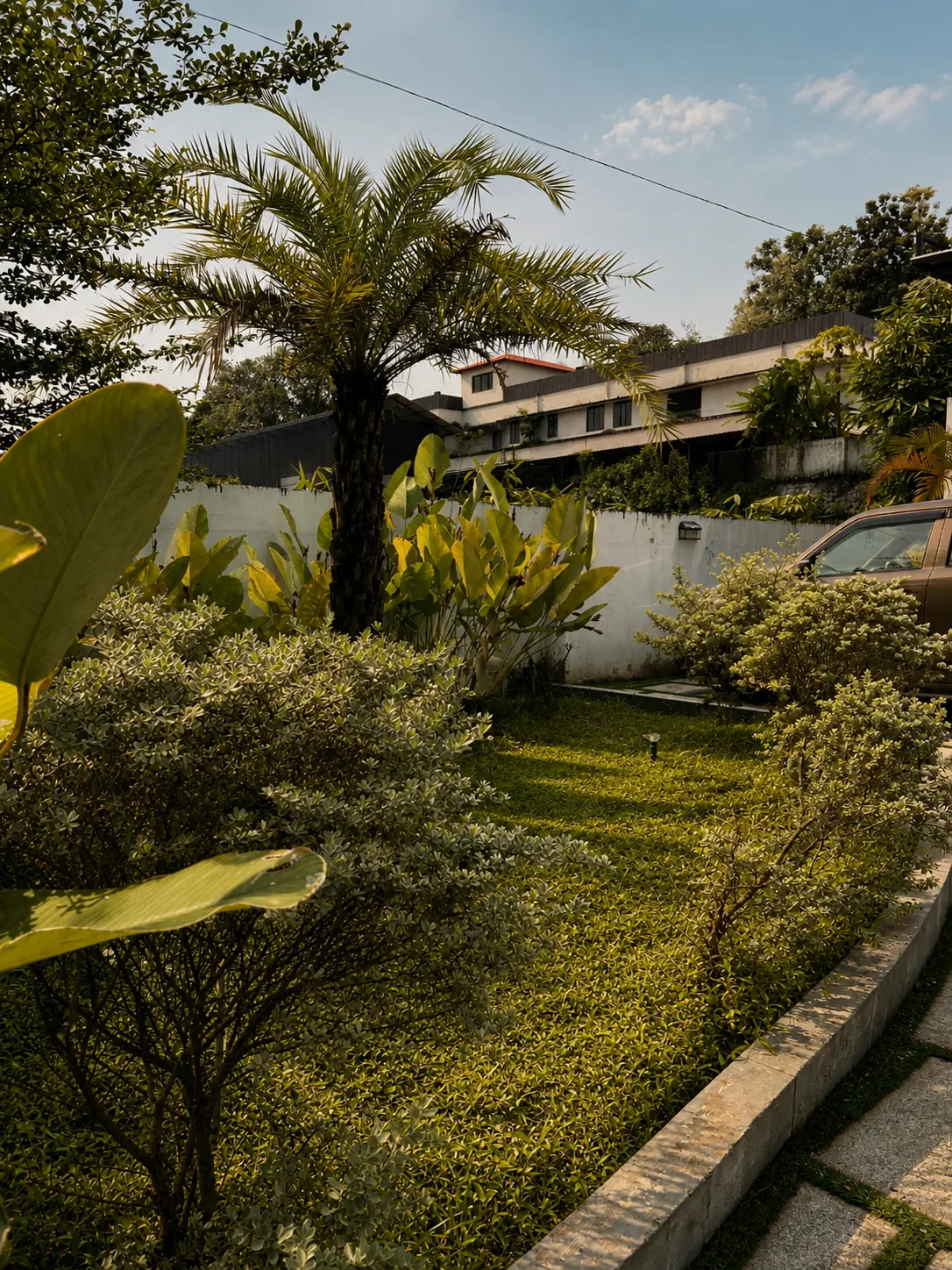 Residential lawn and villa with sprinklers running