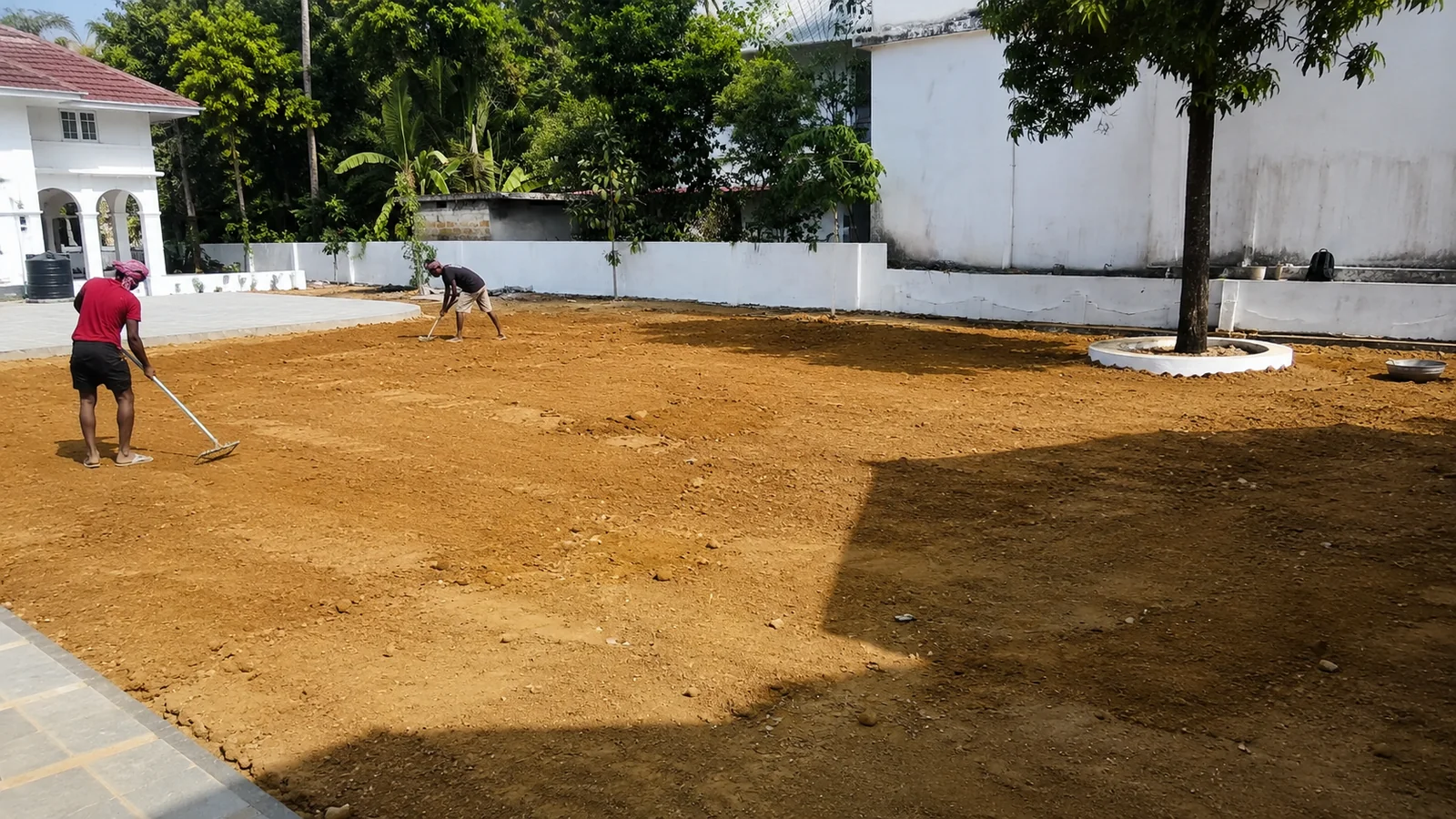 Ground preparation and soil conditioning for a new lawn
